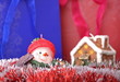 Christmas decorations: a snowman and a house candle Christmas decorations: a snowman and a house candle
