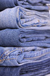 Blue jeans stacked closeup, focus on jeans corner Blue jeans stacked closeup, focus on jeans corner
