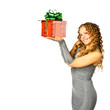 Foto: The girl with a gift in cheerfully box smiles new year The girl with a gift in cheerfully box smiles new year