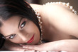 Sensual naked young Black haired adult Caucasian woman