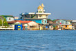 Temple and house on the Chao Praya River, bangkok, Thailand..