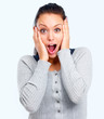 Portrait of surprised young lady looking at you