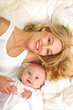 Beautiful Mother and Smiling Baby Beautiful Mother and Smiling Baby