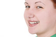 Portrait of a smiling pierced redheaded girl.