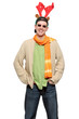 Cheerful casual young man wearing fake reindeer horns