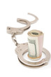 business fraud concept with handcuff and usd dollars