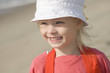 Smiling cheerful girl on the seacoast