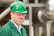 Middle ages industrial worker in front of some tubes