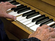 close up of elderly woman playing piano
