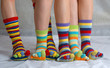 Many colored socks. closeup image of six legs