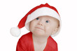 funny baby in big Santa Claus hat on white background