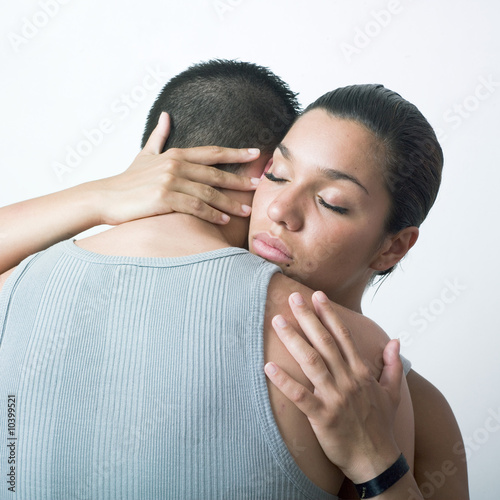 Photo: young woman comforting her boyfriend young woman comforting her boyfriend