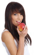 Photo en ligne au meilleur prix young woman holding  apple. Isolated over white
