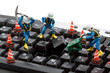 computer repair concept - workers repairing keyboard
