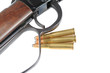 Macro shot of a rifle and three bullets