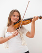 Pretty  woman playing violin isolated on white