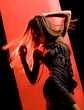 Outline of moving female figure in little black dress