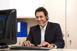male customer service representative at the office with computer