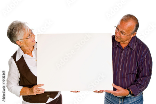 man & woman holding a blank over white background