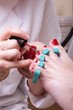 Woman foot in chiropodist hands at pedicure process