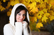 Beautiful young woman in autumn park