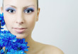 Beautiful woman with blue flowers.