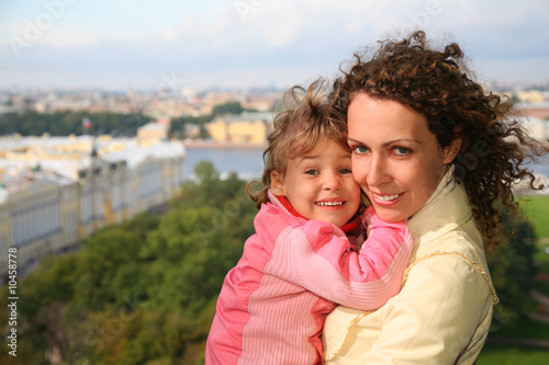 Mother with  child against St.Petersburg