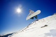 Snowboarder jumps in air with blue sky background