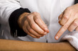 Acupuncturists hands working on male patients back