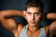 Portrait of sexy young man showing his muscular arms Portrait of sexy young man showing his muscular arms