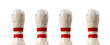 A group of four bowling pins on a white background
