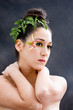 Beautiful brunette face with flower petal makeup, isolated