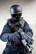 The armed soldier in a camouflage costs in alertness The armed soldier in a camouflage costs in alertness