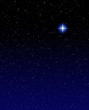 A shining star against a star field background with blue tones.