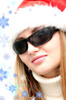 Photo: Beautiful christmas woman in santa hat and sun glasses, Beautiful christmas woman in santa hat and sun glasses,