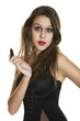 Sultry young brunette holding her lipstick.