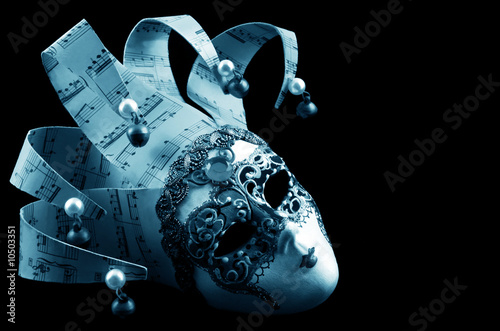 Photo: Venetian mask, isolated on black background. Venetian mask, isolated on black background.