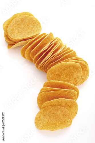 Photo: Potato chips in a row, elevated view Potato chips in a row, elevated view