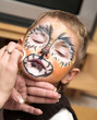 The little boy and a cheerful make-up