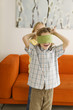 Boy (6-7) and girl (8-9) playing Blind Man's Bluff