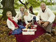 Photo: Germany, Baden-Württemberg, Swabian mountains, Three generation family having picnic in forest Germany, Baden-Württemberg, Swabian mountains, Three generation family having picnic in forest