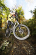 Germany, Bavaria, man performing jump on bicycle
