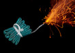String of firecracker with lit fuse, close-up