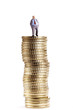 Figurine on pile of coins