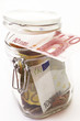 Jar filled with euro bank notes