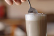Glass of milk coffee, close-up