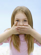 Girl (6-7), shutting mouth, portrait