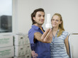 Couple embracing, man holding bulb