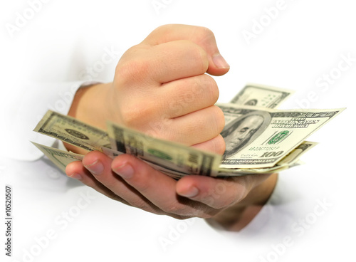 Photo: money dollars in the hands isolated on white background money dollars in the hands isolated on white background