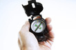 Hand holding compass, close-up